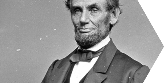 An old black and white photo of Abraham Lincoln from the chest up