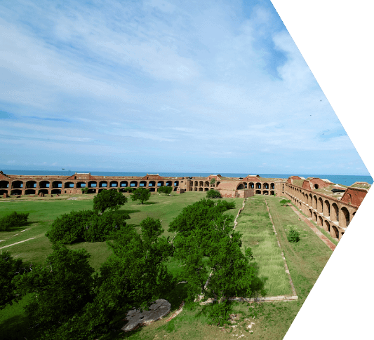 Aerial view of the large wide open space filled in with grass in the middle of Ft. Jefferson in the Dry Tortugas