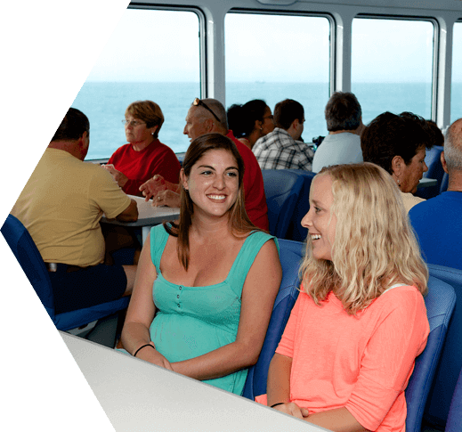 Two women conversing aboard the Yankee Freedom on the way to the Dry Tortugas