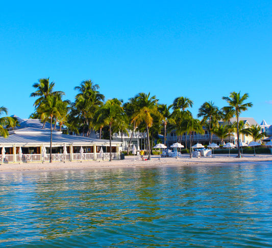 A view of the bungalows and extra amenities from across the water of South Beach Key West