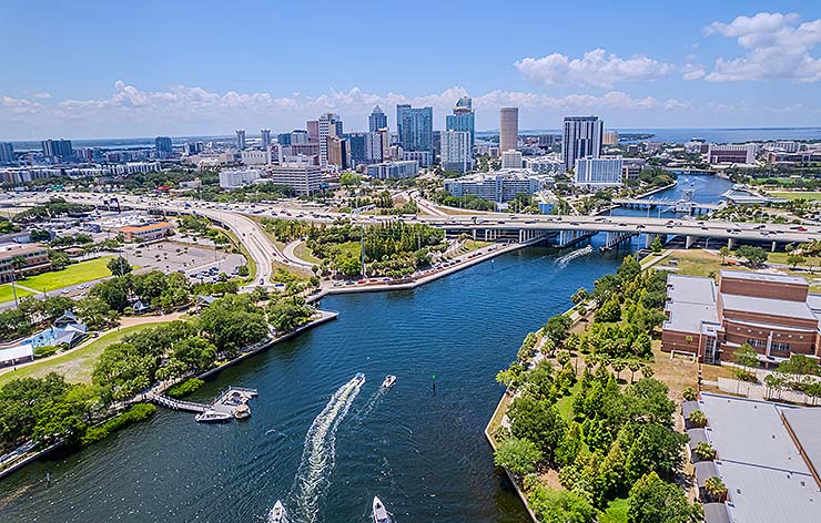 Vibrant Tampa Bay scene featuring various boats cruising